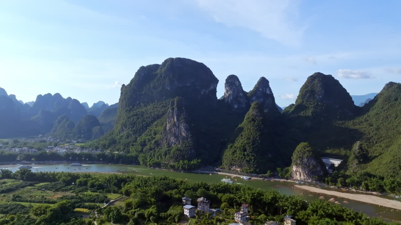 Aerial view away from karst mountain peaks at Xingping, in sunny Guilin, China