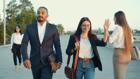 business people walking outdoors
