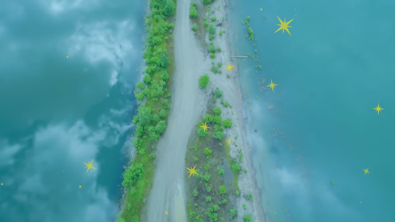 Animation of stars falling over landscape, sea and clouds