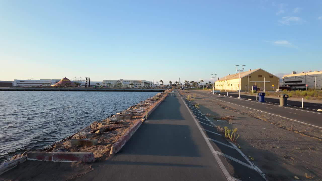 Slow motion push in of the public pathway at Ferry Point in Alameda California