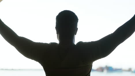 Man,-stretching-arms-and-silhouette-with-freedom