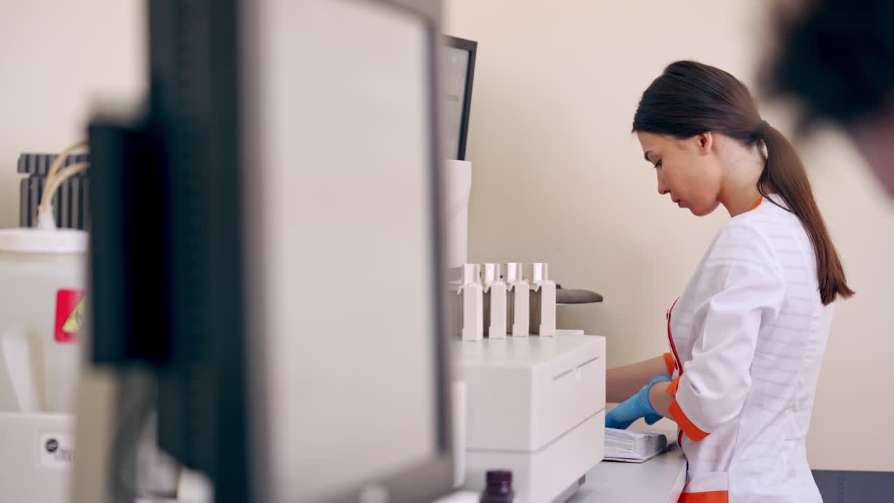 Laboratory workers use modern equipment. Medical technicians working with new devices in the research laboratory. Healthcare concept.