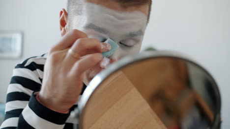 clown applying makeup