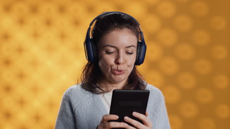 woman wearing headphones, practicing new language using internet app