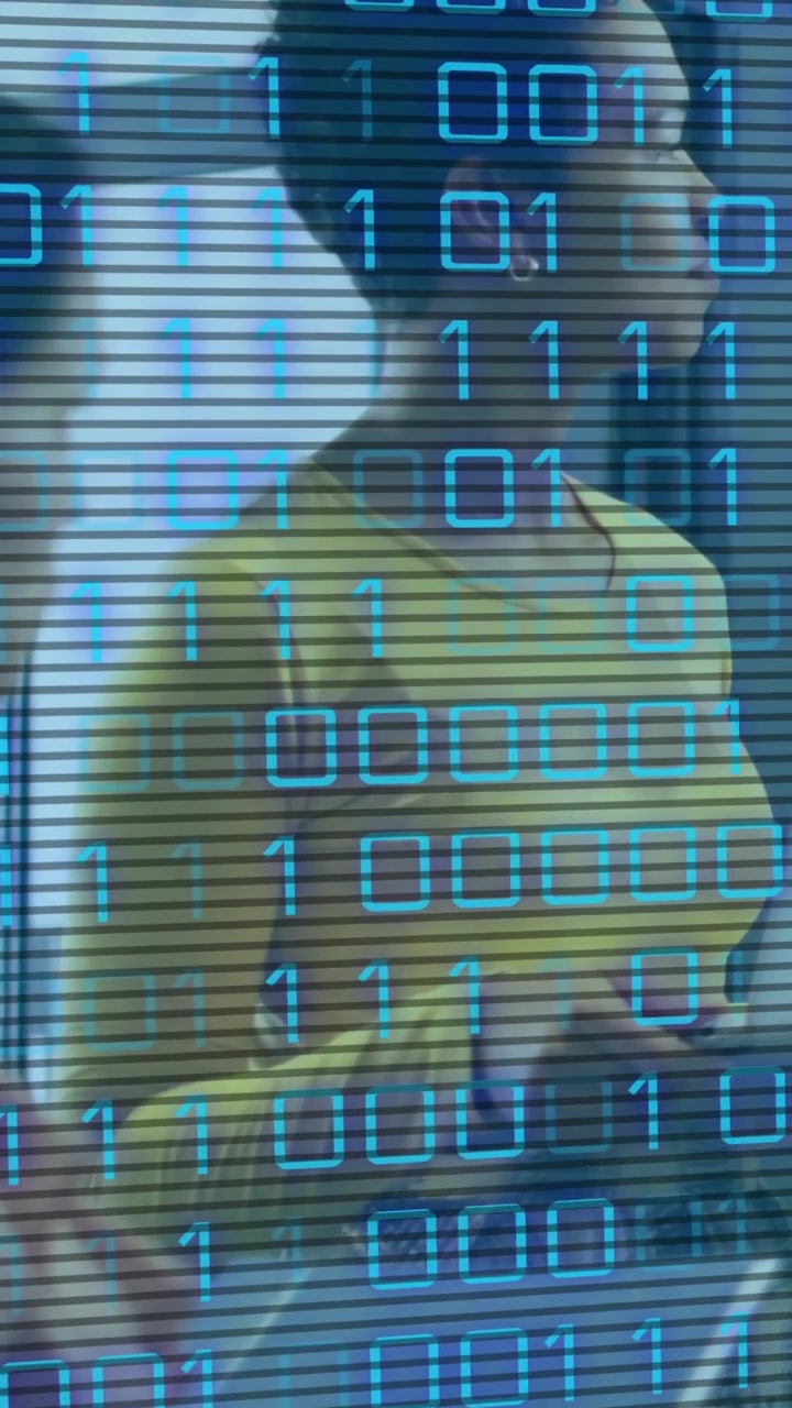 Vertical video: Woman in yellow shifting, turning right, hands moving, binary scrolling for tech