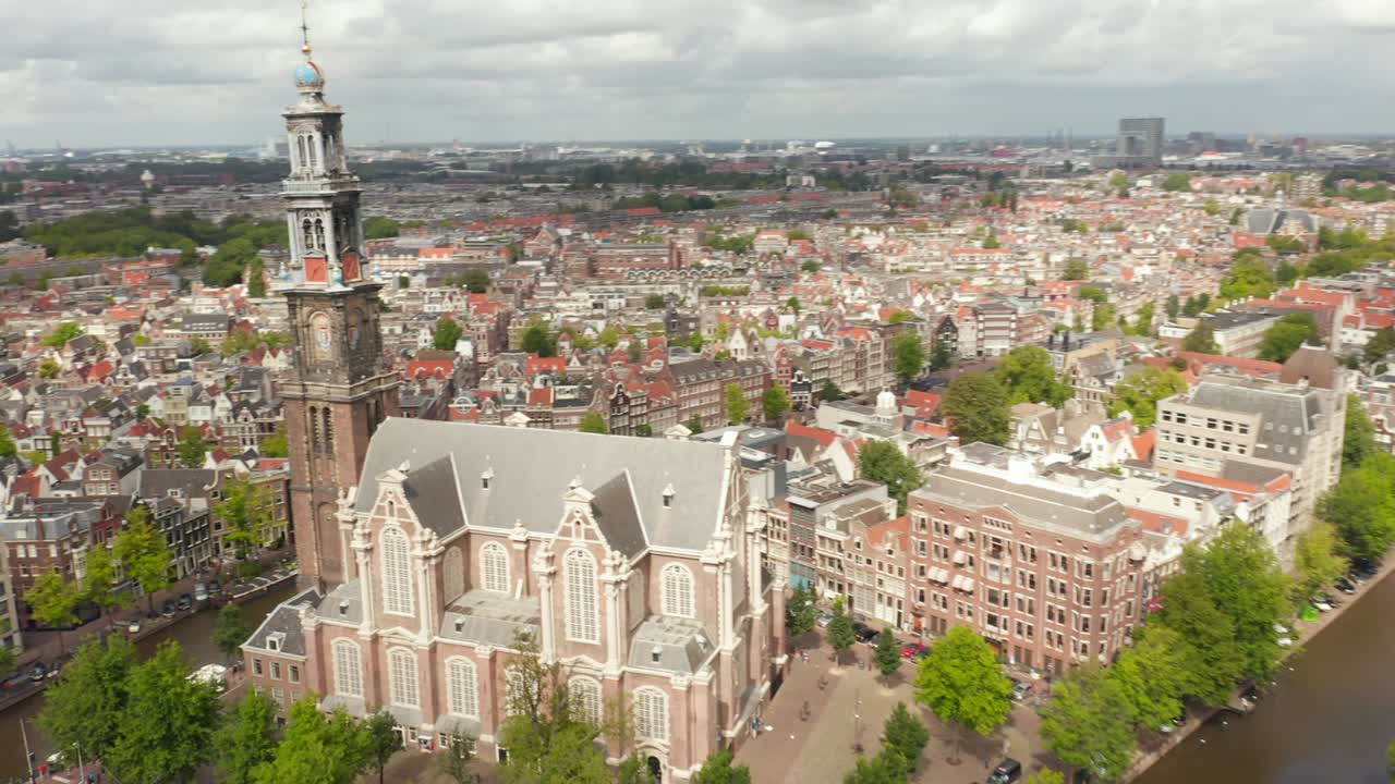 Flight above Anne Frank House and beautiful Church in Amsterdam, circling Aerial