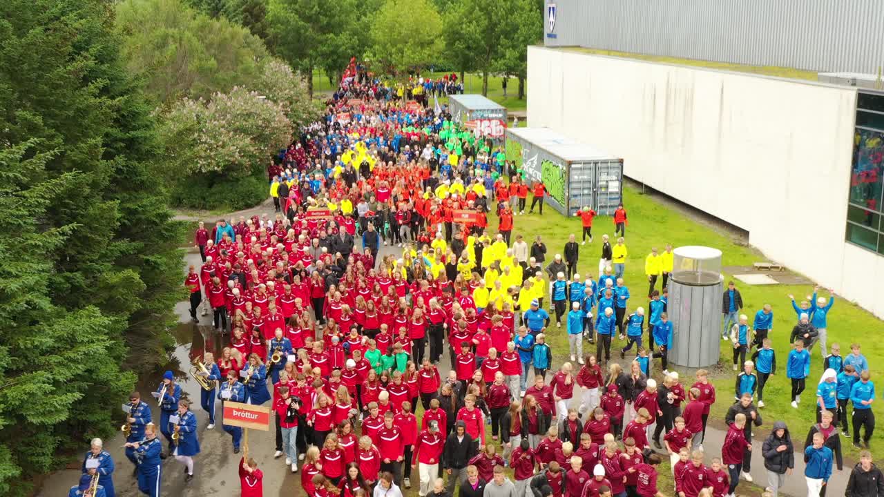 School kids on sports day in colourful dresses, Aerial