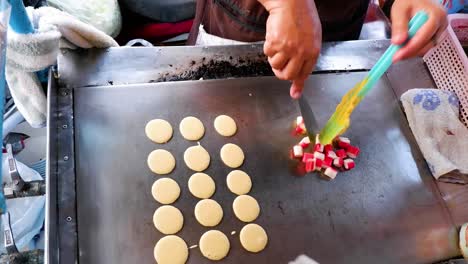 cooking crab stick pancakes on a hot griddle