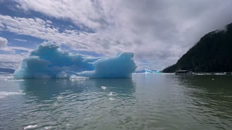 excellent footage of ice floating off an iceberg in alaska's laconte bay