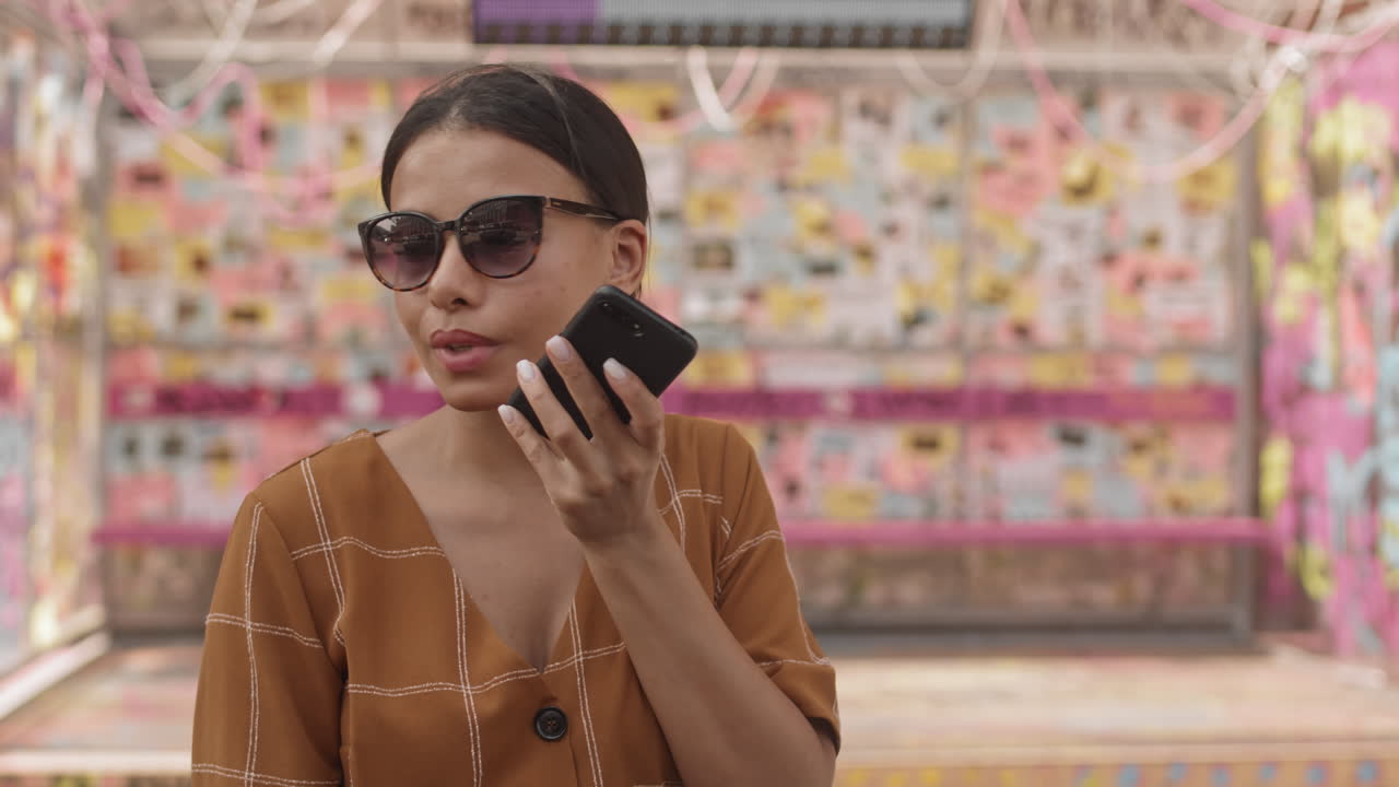 Woman Talking on Speaker Phone