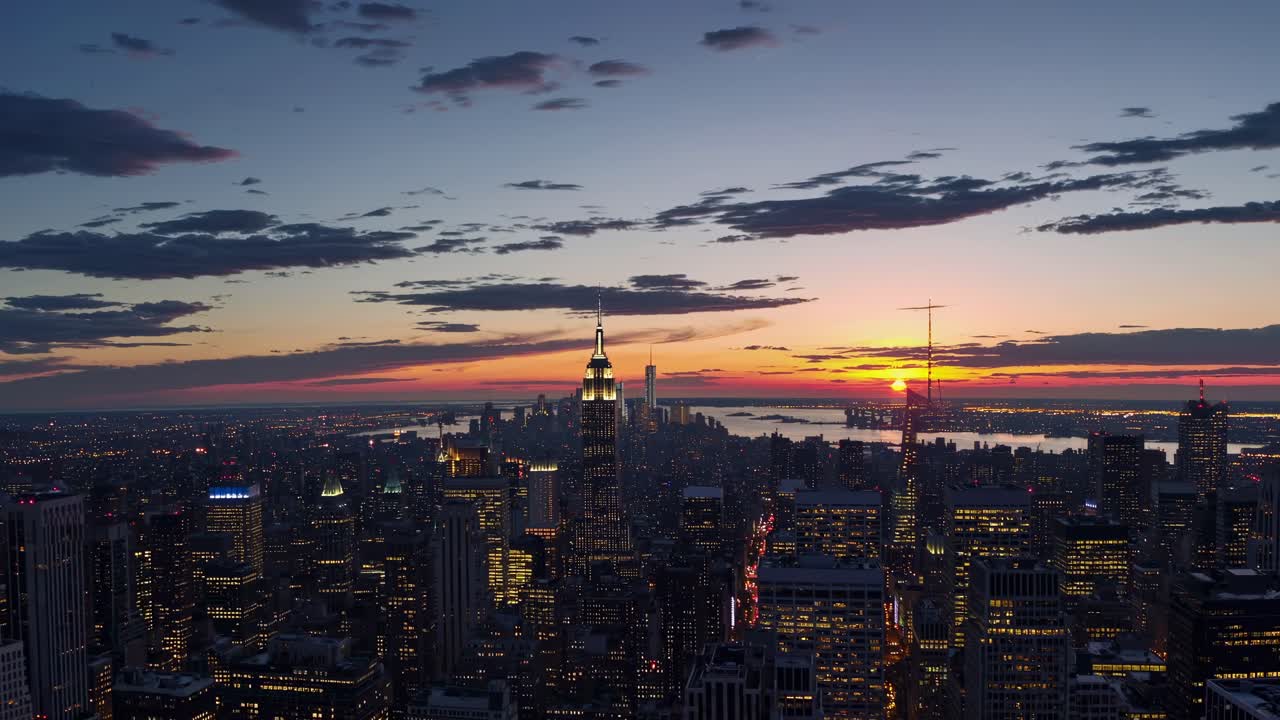 Aerial video shot of a city skyline at sunset, capturing vibrant colors and urban architecture