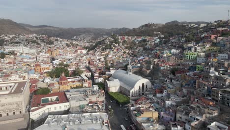 aerial pans across dry mountain plateau cityscape of guanajuato, mx