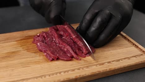 cutting raw beef