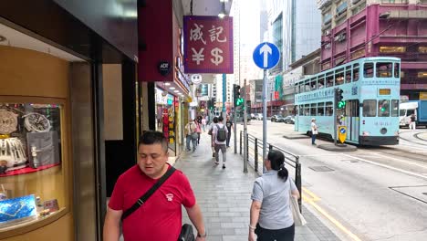 people walking along a bustling city street