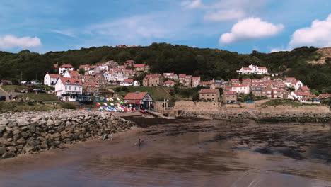 North-York-Moors,-Heritage-Coast,-Runswick-Bay,-Phantom-Drone-Footage-of-Village-from-beach---Clip-4