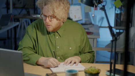 man working late in office