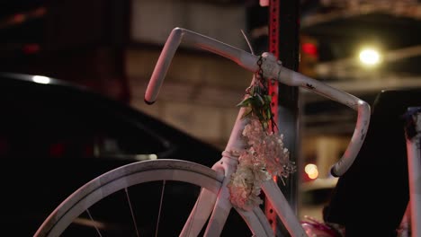 ghost bike memorial and flowers for tragic accident that killed cyclist