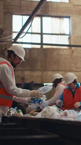 recycling plant workers sorting waste