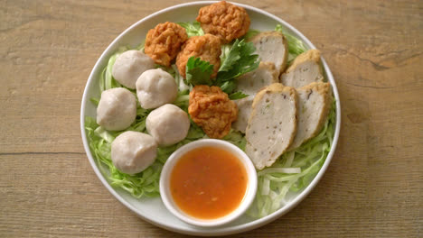 boiled fish balls, shrimp balls and chinese fish sausage with spicy dipping sauce