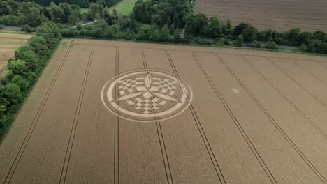 aerial view approaching south wonston 2023 golden wheat filed crop circle, hampshire farmland vandalism