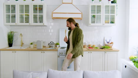 man singing in the kitchen