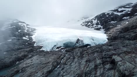 Drone-view-of-Brewster-Glacier-during-a-cloudy-day-Brewster-Track-in-Mount-Aspiring-National-Park,-New-Zealand