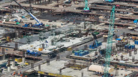 time lapse of construction site with heavy construction machinery in metropolis