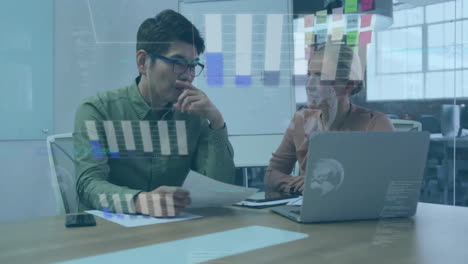 Animation-of-graphs-and-globes-over-diverse-coworkers-discussing-reports-on-laptop-in-office