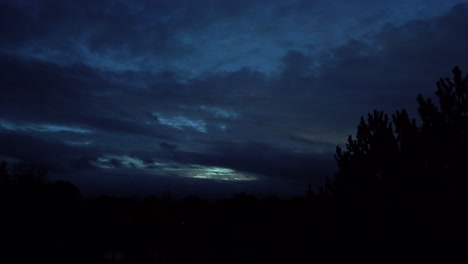 dark cloudy sky with light breaking through at dusk