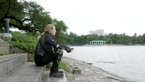 young smiling female tourist enjoying the view, bay mau lake, hanoi