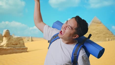 happy traveler in front of the pyramids