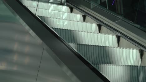 close-up view of an escalator moving upward