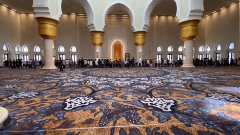 viewpoint of the congregation walking towards the line of worshippers who will perform the prayer service, at the sheikh zayed grand mosque, surakarta, indonesia