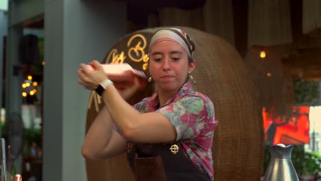 female bartender woman mixologist shaking drink at beach restaurant cantina bar mexican latin equality empowerment job