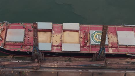 aerial view of solid bulk cargo ship loaded with grains for export