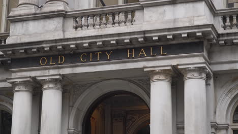 dolly-gimbal shot revealing the old city hall entrance, close-up