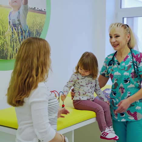 doctor examining little girl