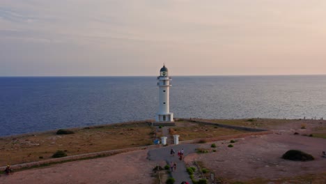 Dramatic-pull-out-shot-from-Far-De-Barbaria-on-Formentera-Island,-Spain