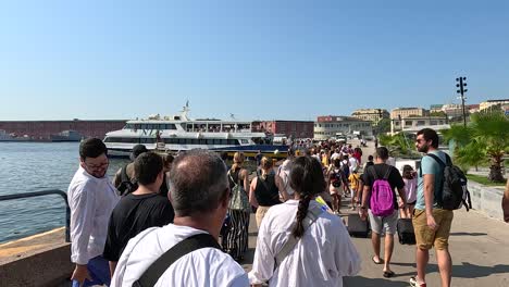 people boarding a boat in sorrento, italy