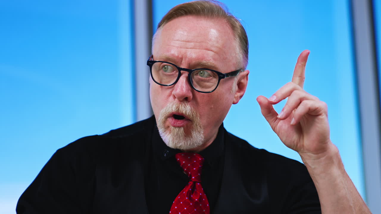 Mature Caucasian man wearing glasses having an idea. A sudden idea or problem solving came to man's mind. Close up.