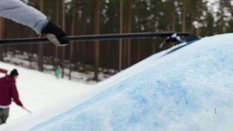 man shaping a kicker jump at a snow ski mountain in sweden