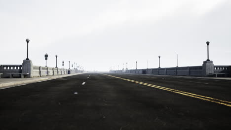 empty road on a long bridge