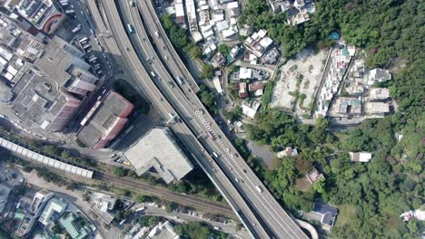 Massive-Highway-interchange-with-traffic-on-all-levels-in-downtown-Hong-Kong,-Aerial-view