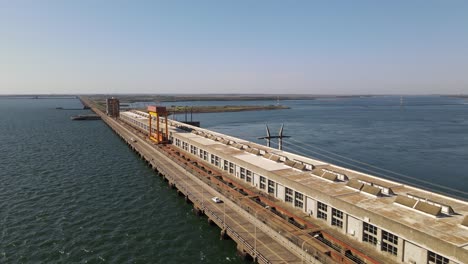 Aerial-view-showcasing-the-Yacyretá-hydroelectric-power-plant,-a-remarkable-engineering-feat-situated-along-the-Paraná-River,-providing-clean-energy-to-Argentina-and-Paraguay