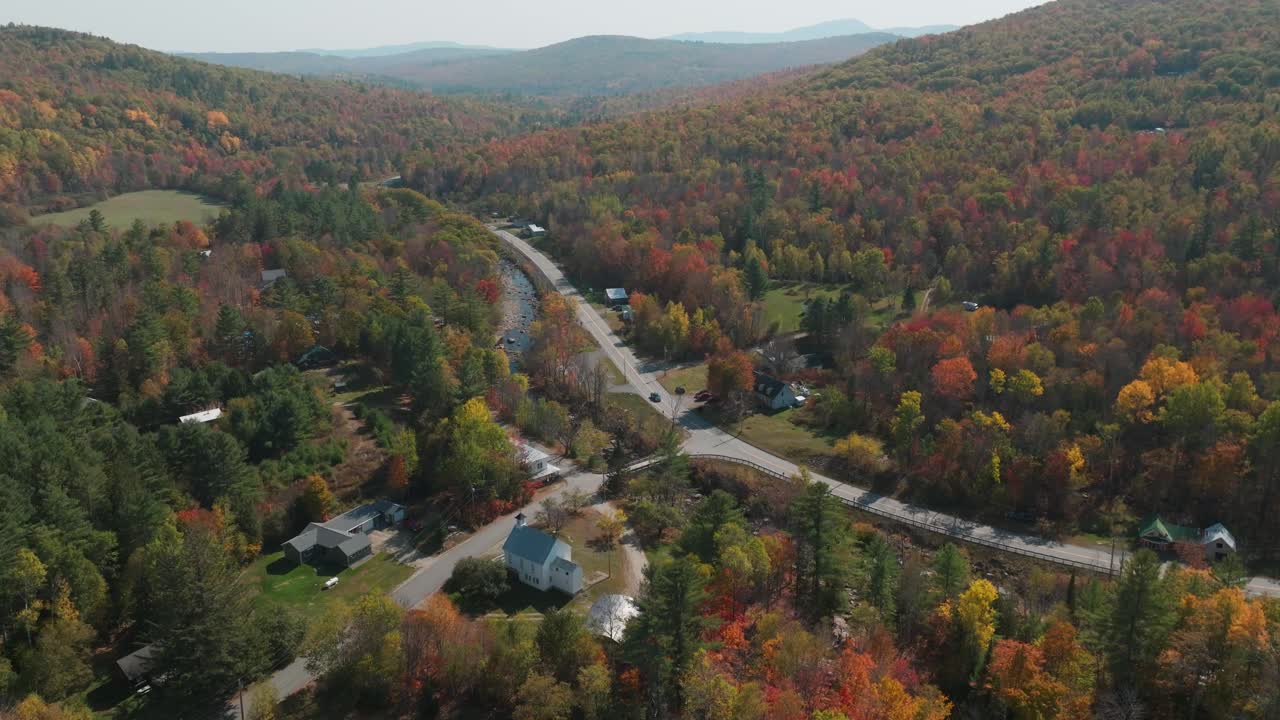 Aerial Drone View of Route 4 in Madrid, Maine - Scenic Highway Through Colorful Autumn Forest