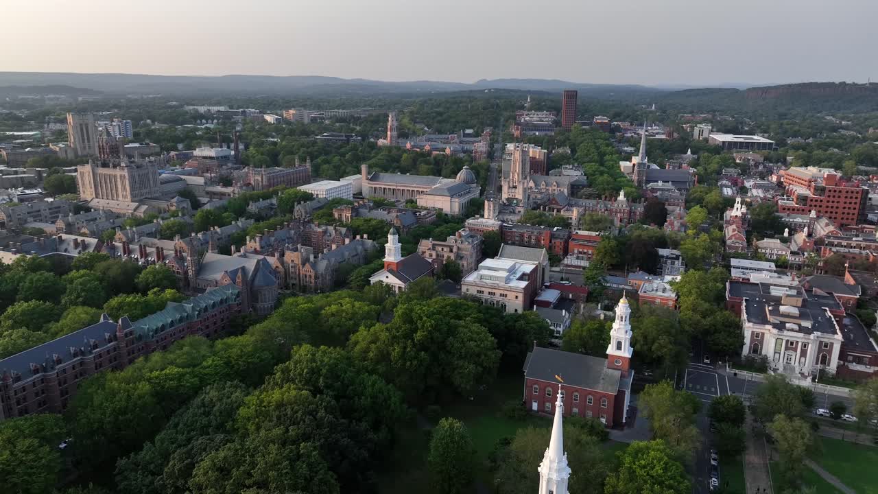 Historic city of New Haven with churches, famous Yale university in gothic architecture and downtown. Dusk scene after sunset. Drone wide shot. Connecticut , USA