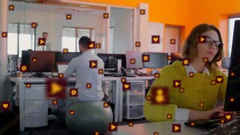 animation of network of digital icons against caucasian woman using computer at office