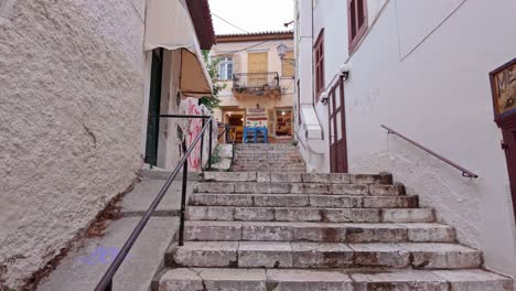 steep stone steps up quaint side street in greek coastal tourist town