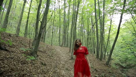 beautiful woman walking through green forest