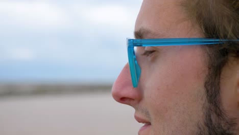 Slow-motion-shot-of-a-man-looking-out-at-the-Sete-Salt-Flats-changing-focus